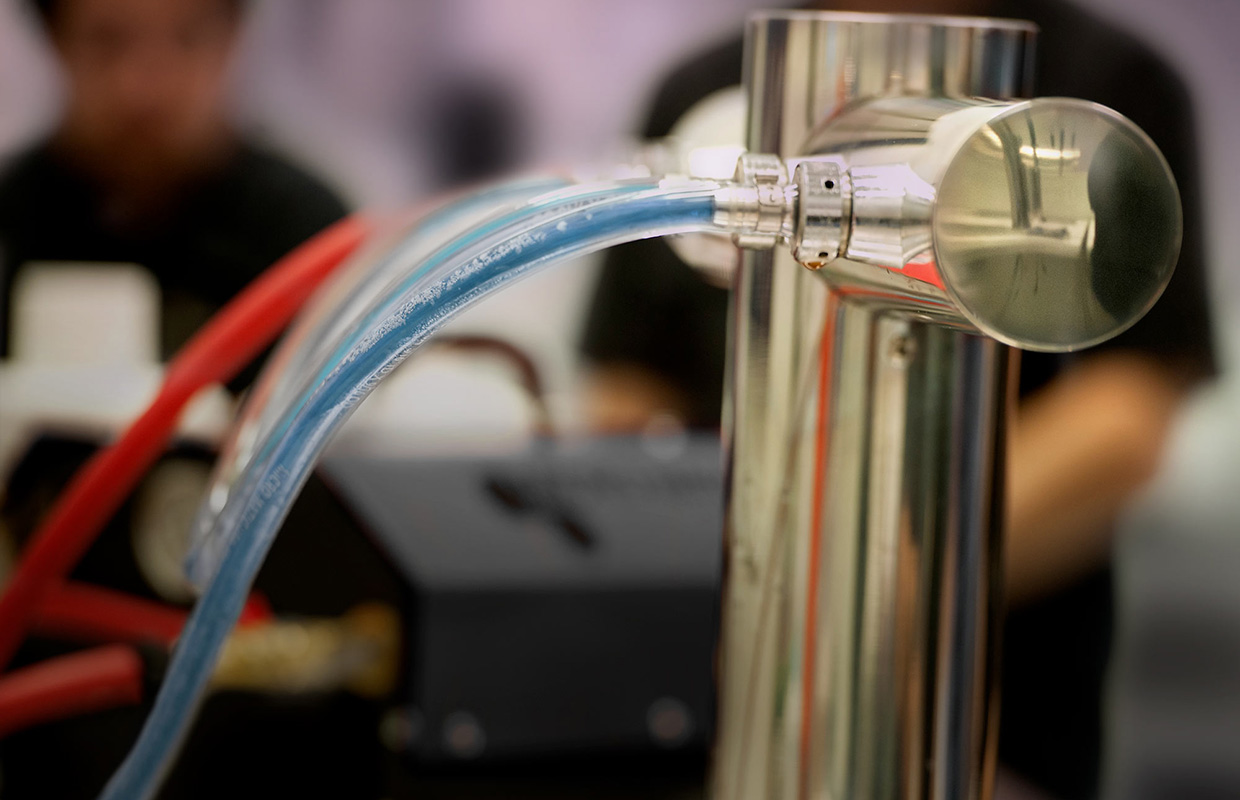 Draft line cleaning in progress — recirculation pump connected to tap tower